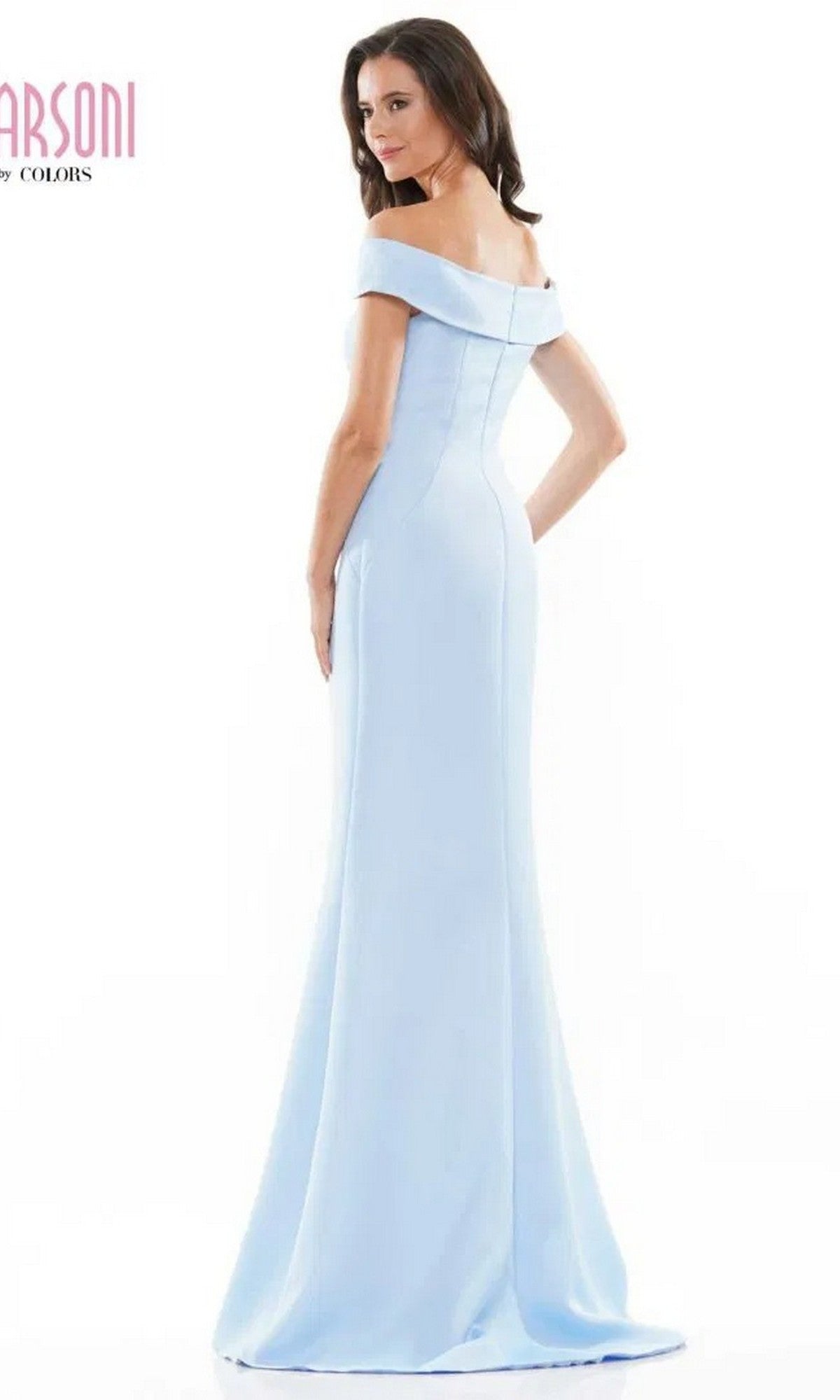 A woman wearing the Marsoni MV1153 long formal dress stands facing away, looking over her shoulder, against a plain white background.